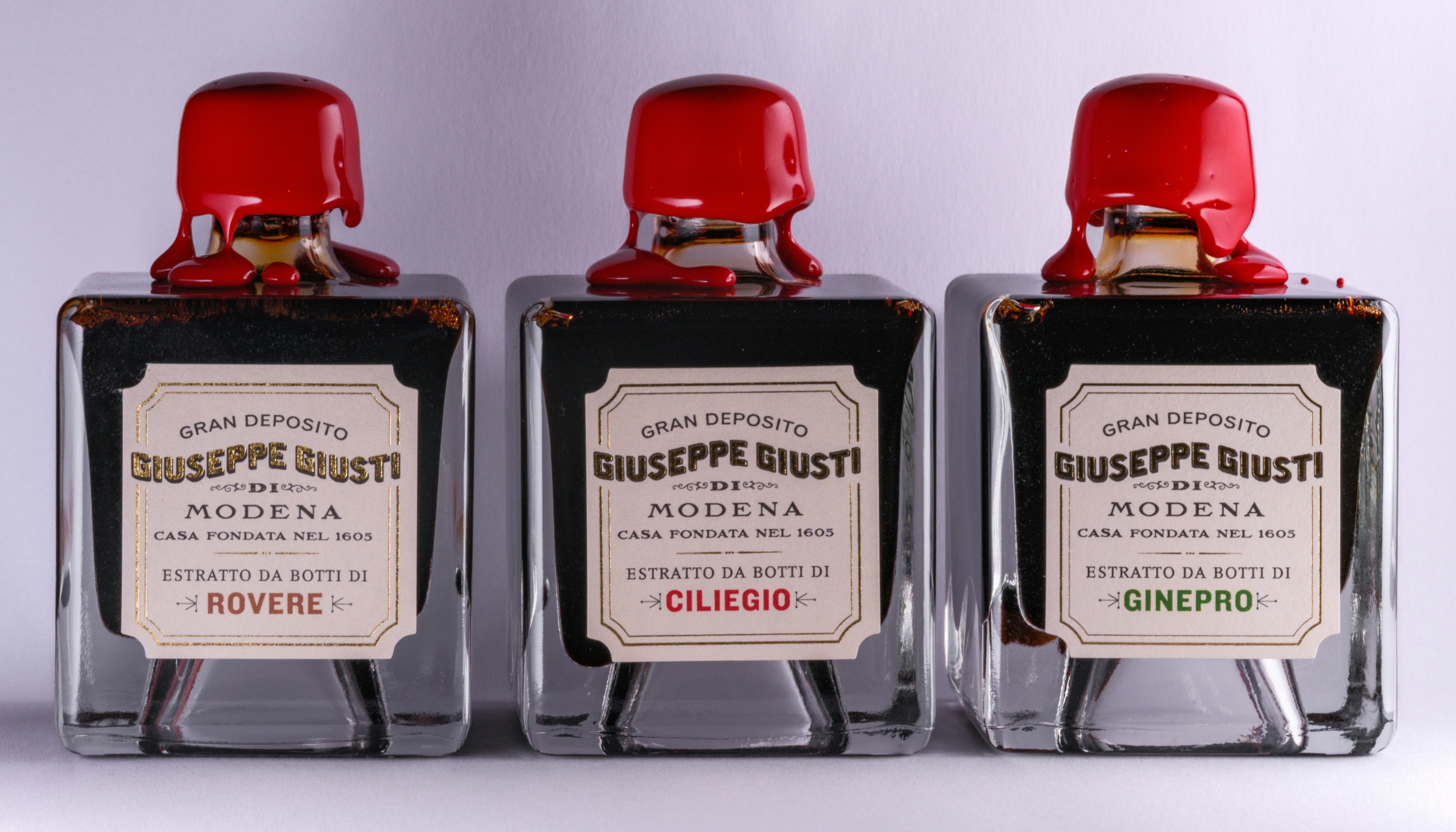 Three bottles of ink sitting next to each other