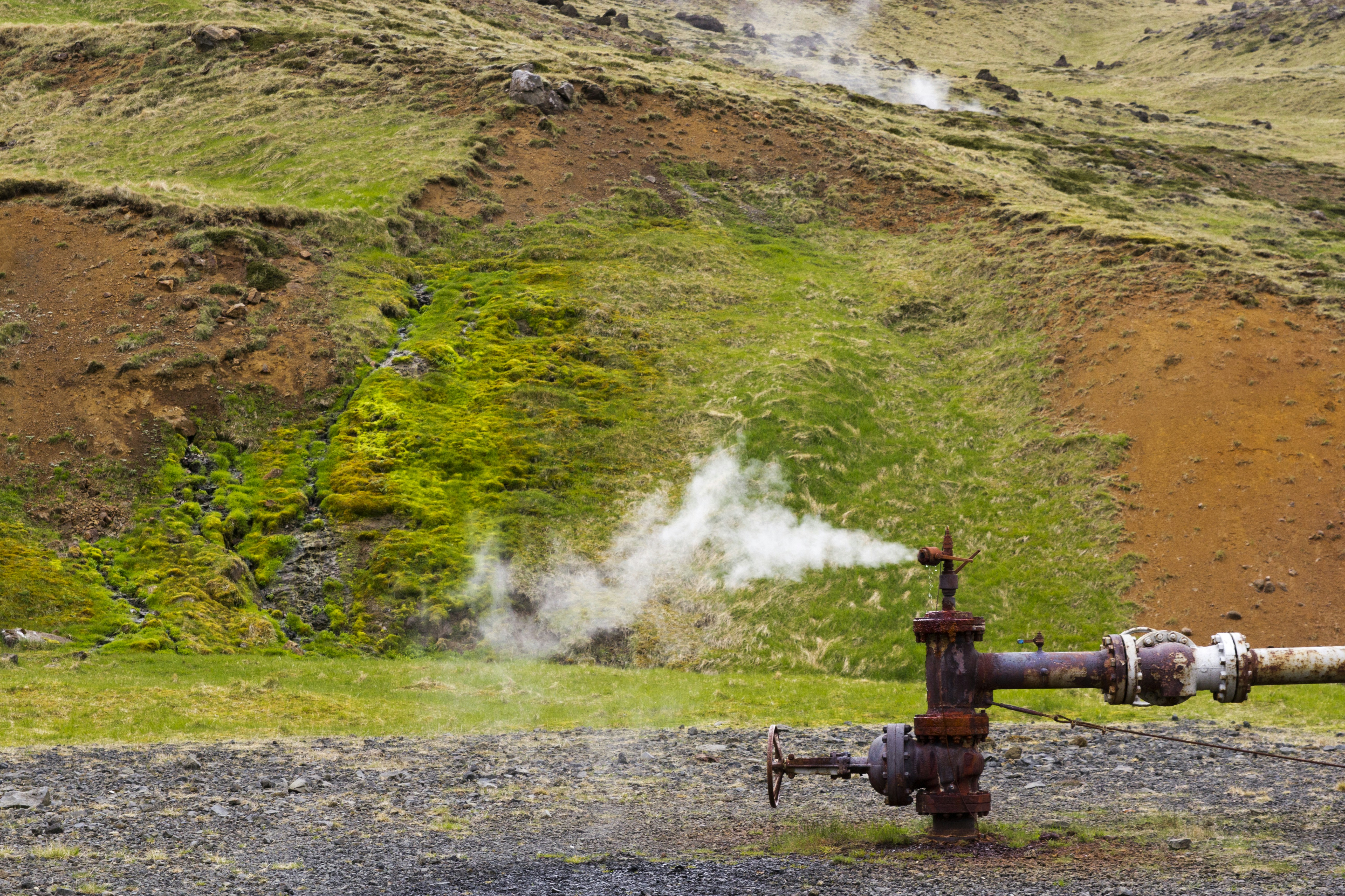 A large pipe with steam coming out of it