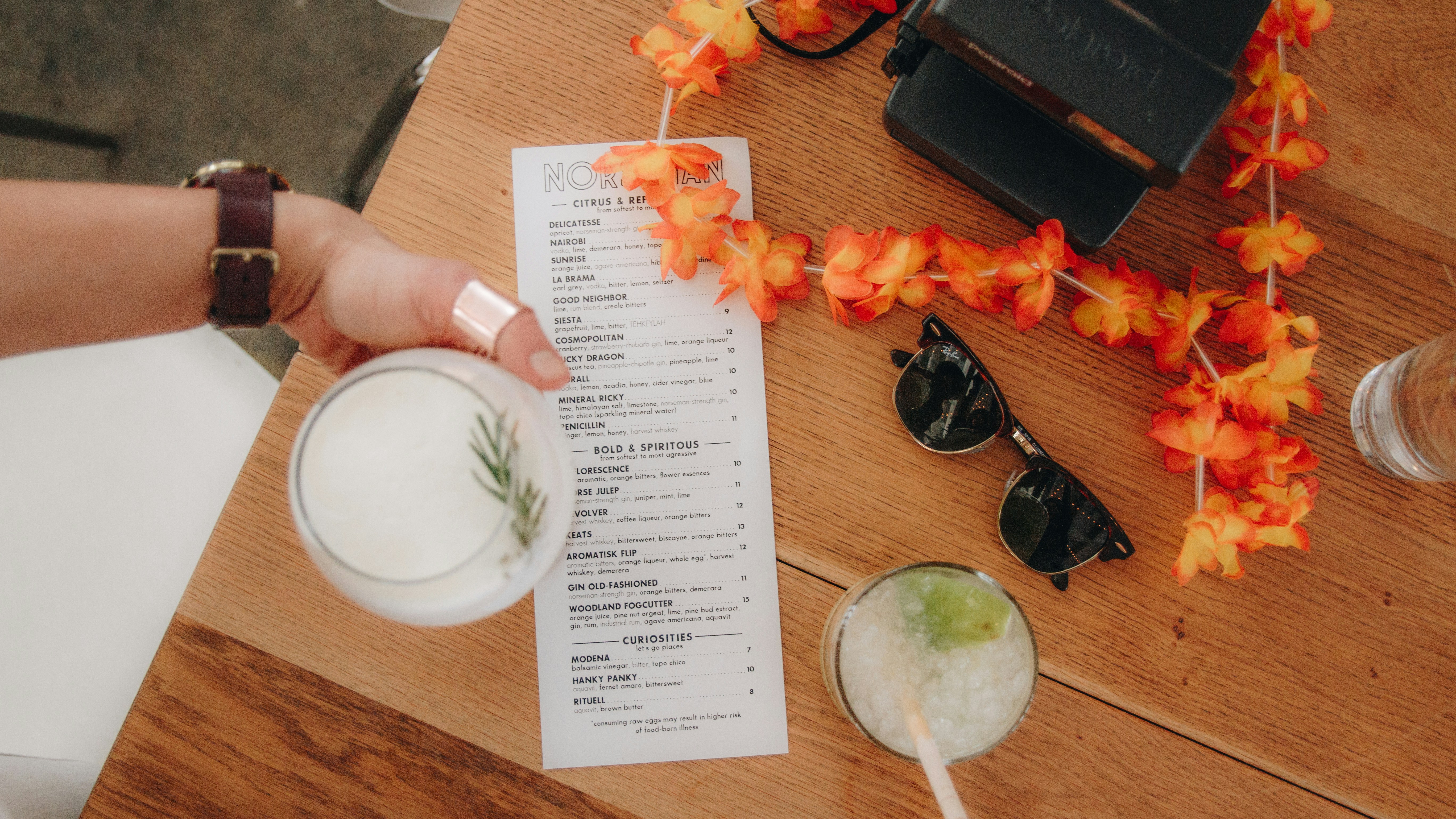 Person checking a bill at a cafe table