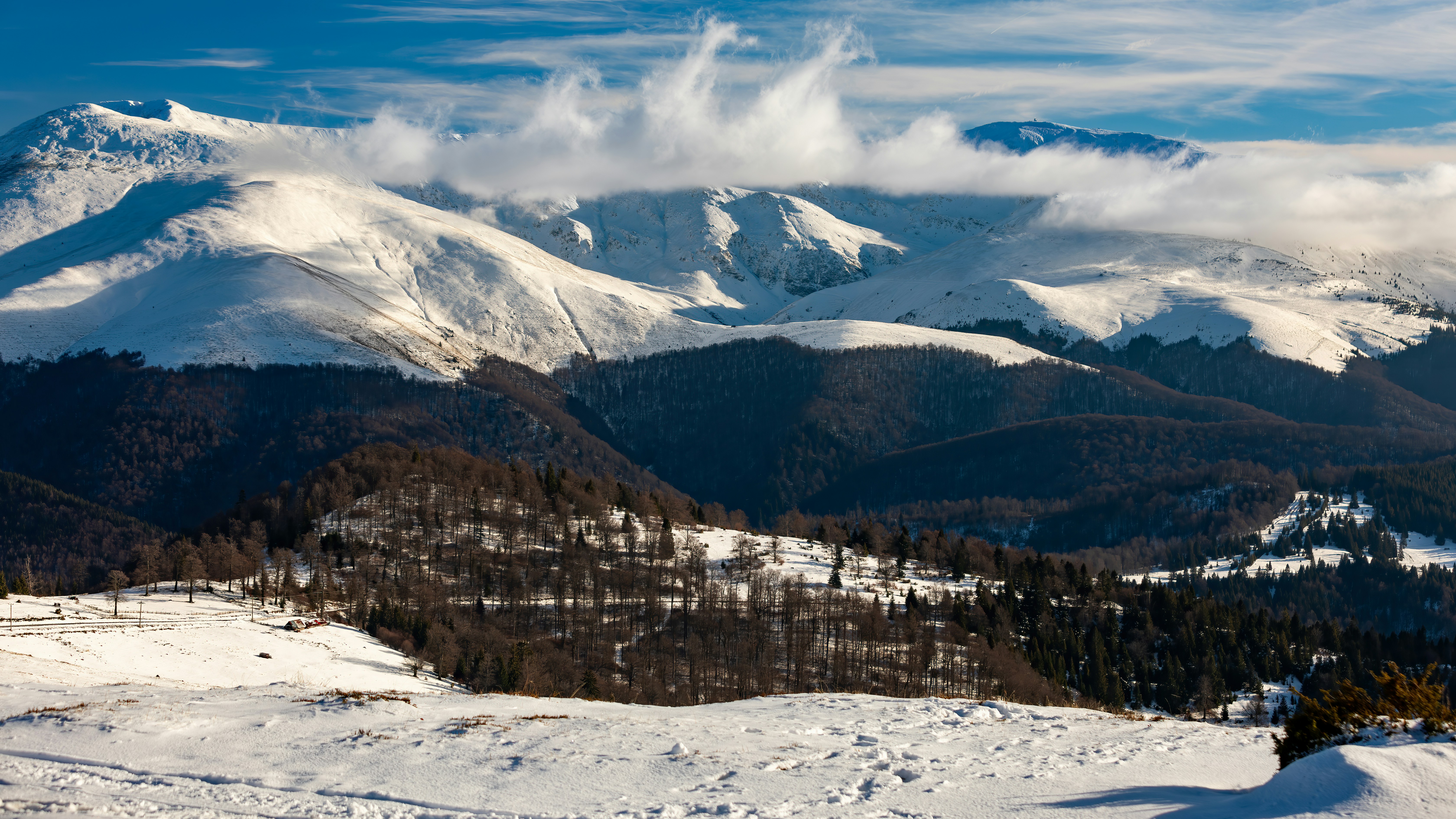 A view of a mountain range covered in snow