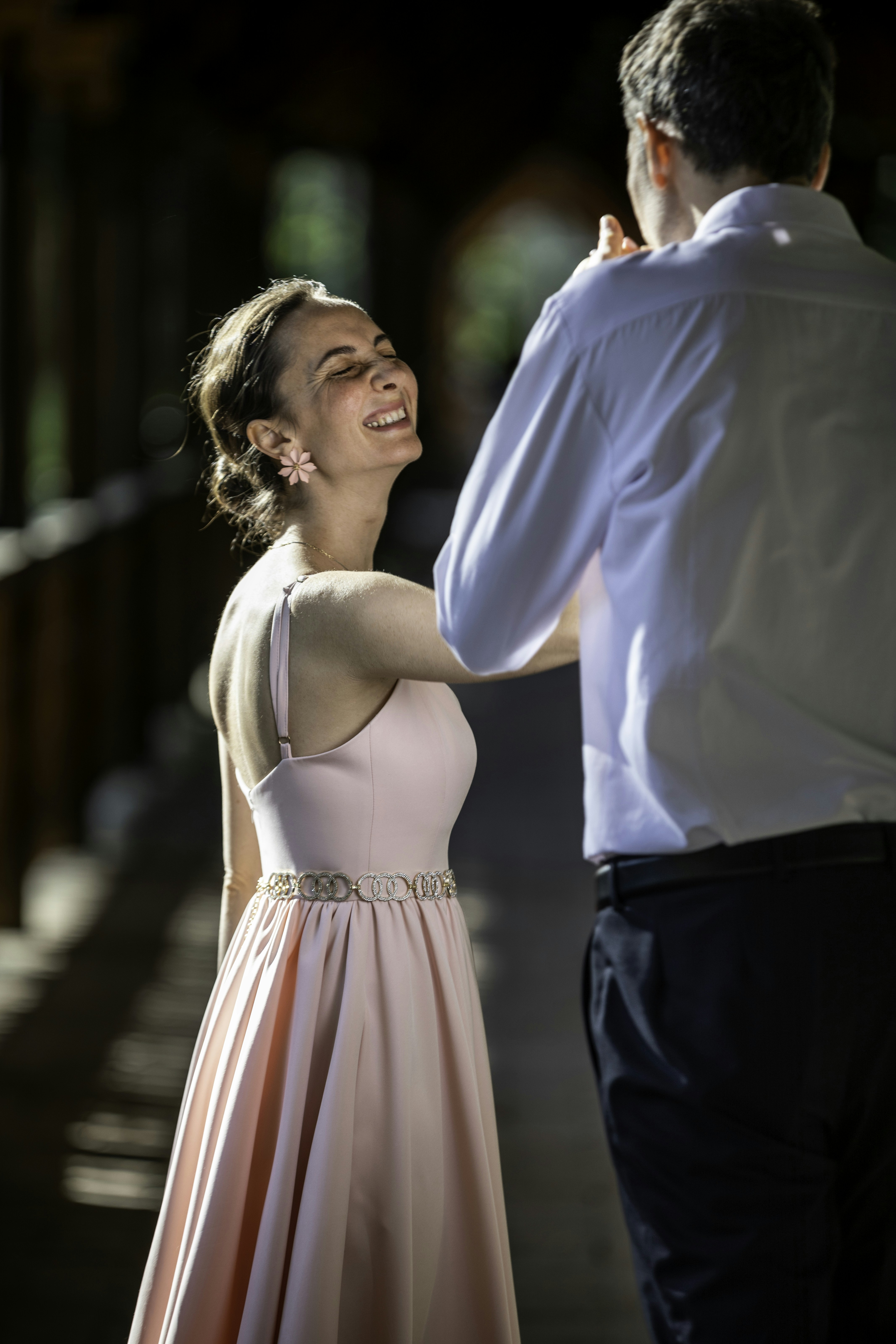 A man standing next to a woman in a dress