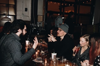 A group of people sitting around a table talking