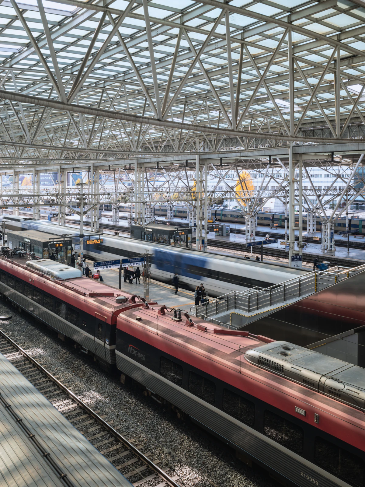 Korean trains waiting under the glass roof of Seoul Station