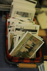 A red suitcase filled with lots of papers