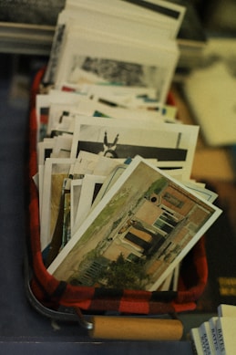 A red suitcase filled with lots of papers