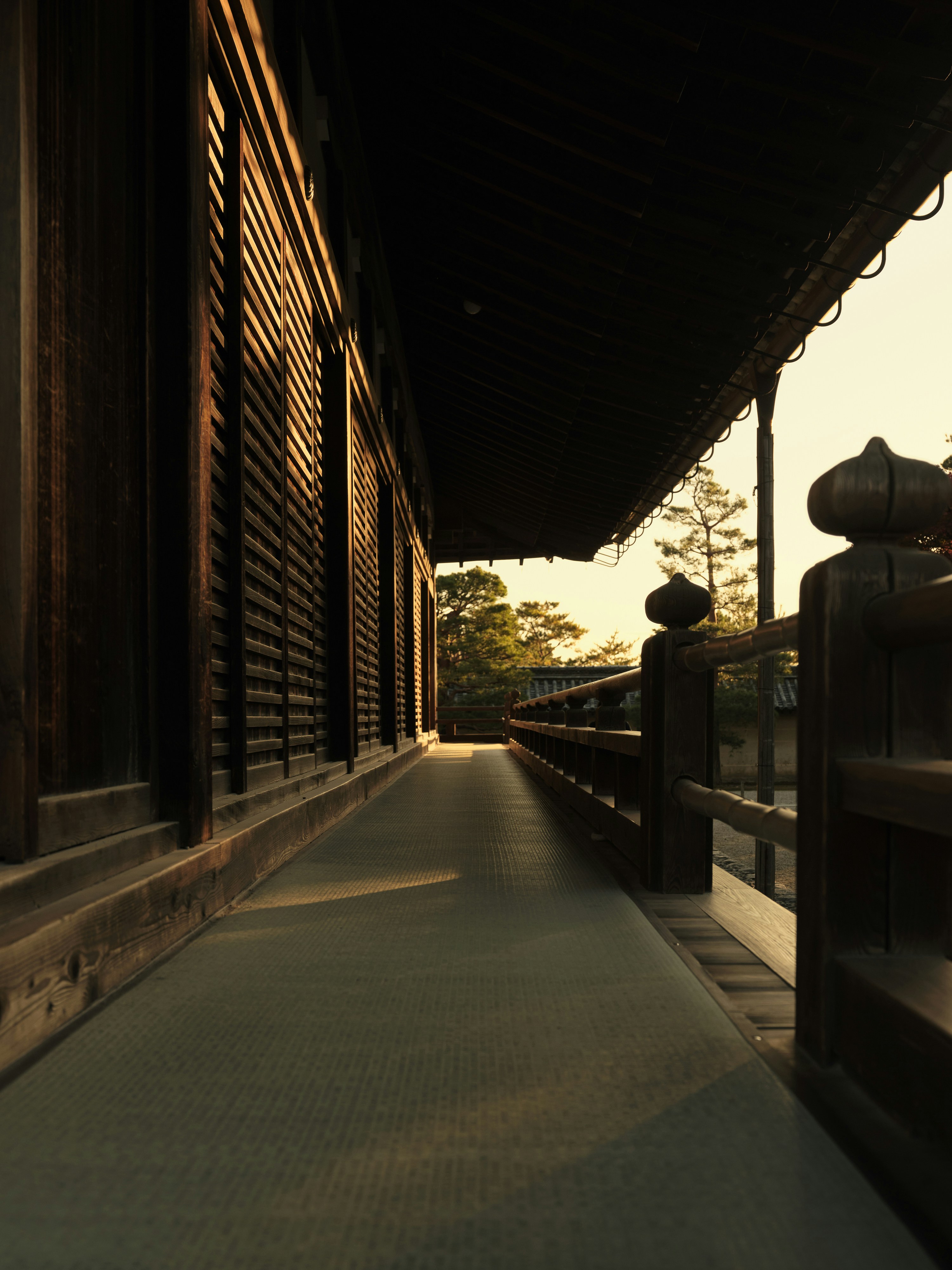 A long walkway between two buildings on a sunny day