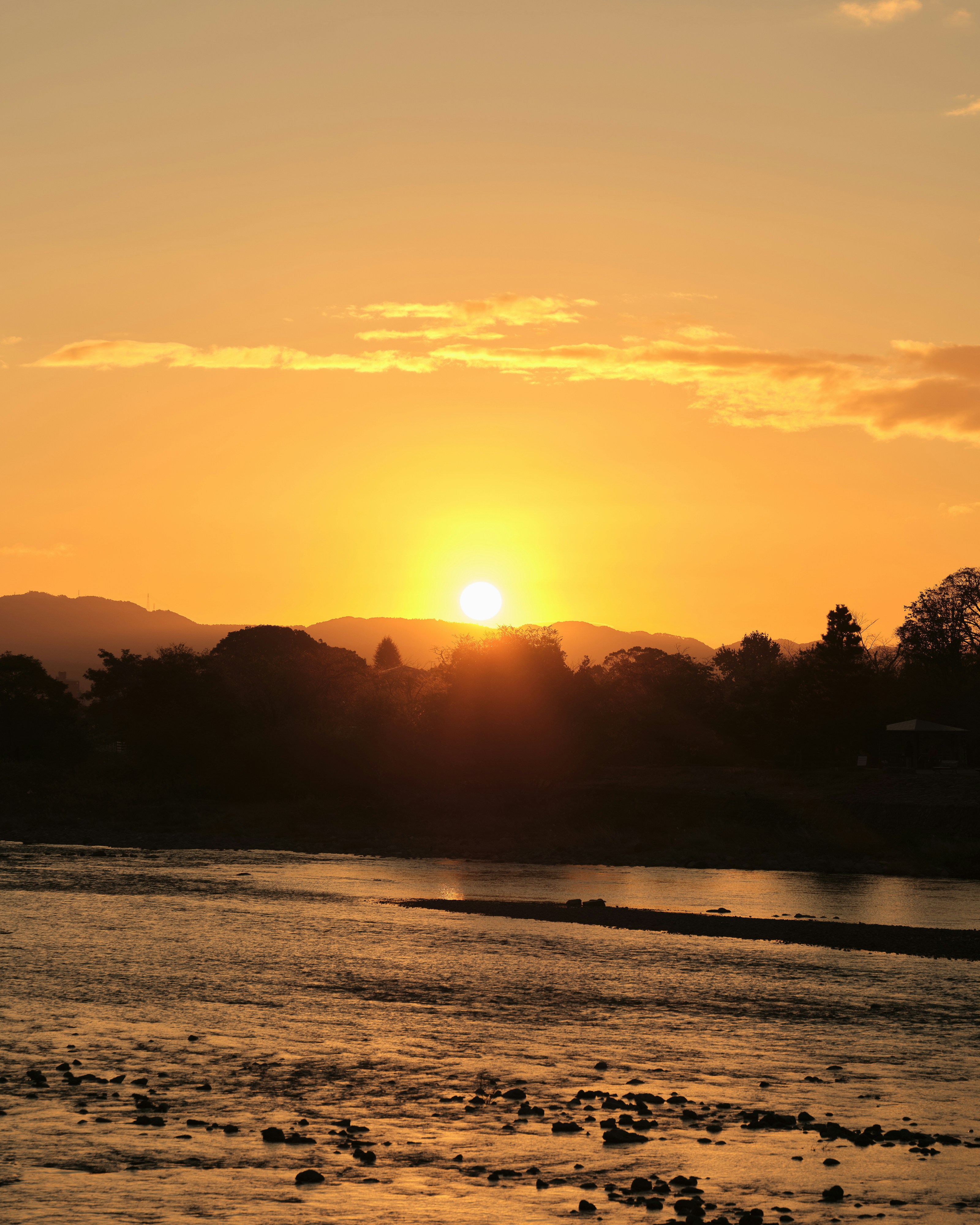 The sun is setting over a body of water