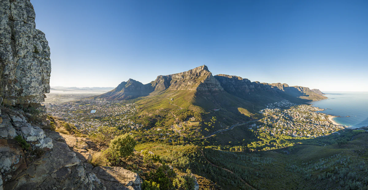 Table Mountain and the ridge above Camps Bay, seen from a rocky ledge on a clear day