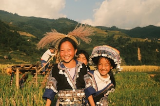 A group of people standing on top of a lush green field
