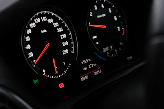A close up of a speedometer in a car