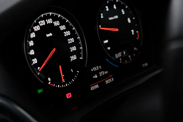 A close up of a speedometer in a car