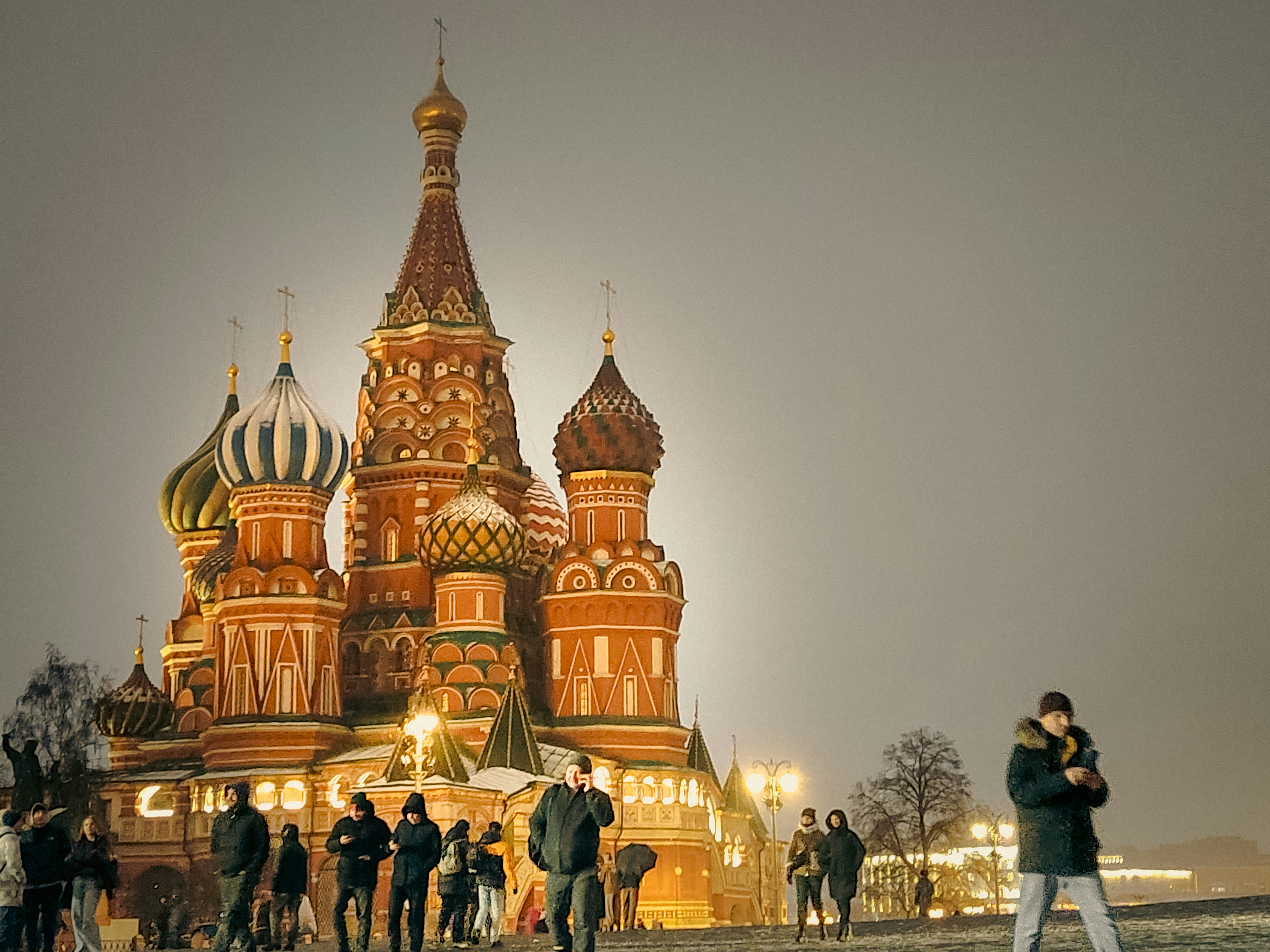 A group of people standing in front of a building