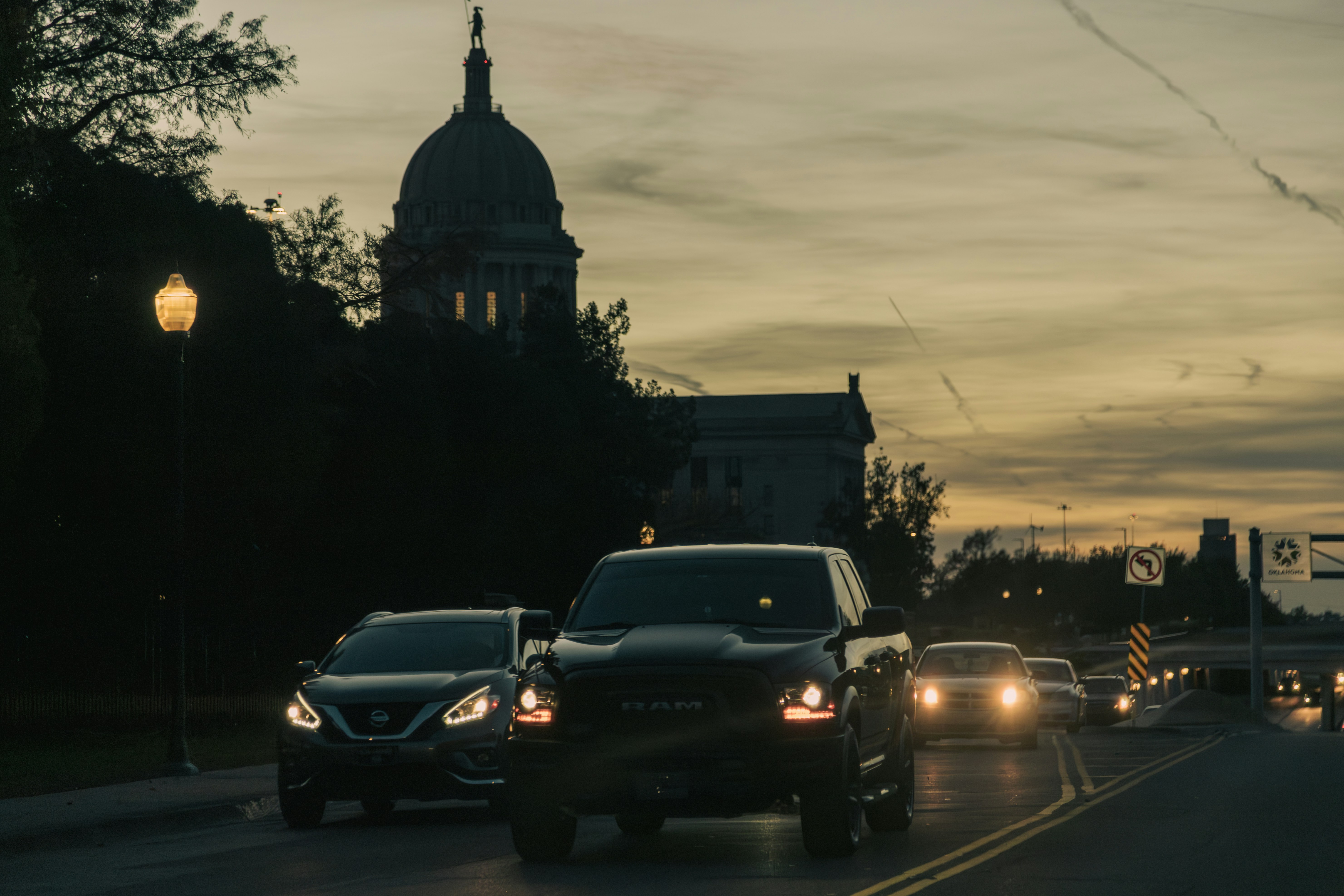 A bunch of cars that are sitting in the street