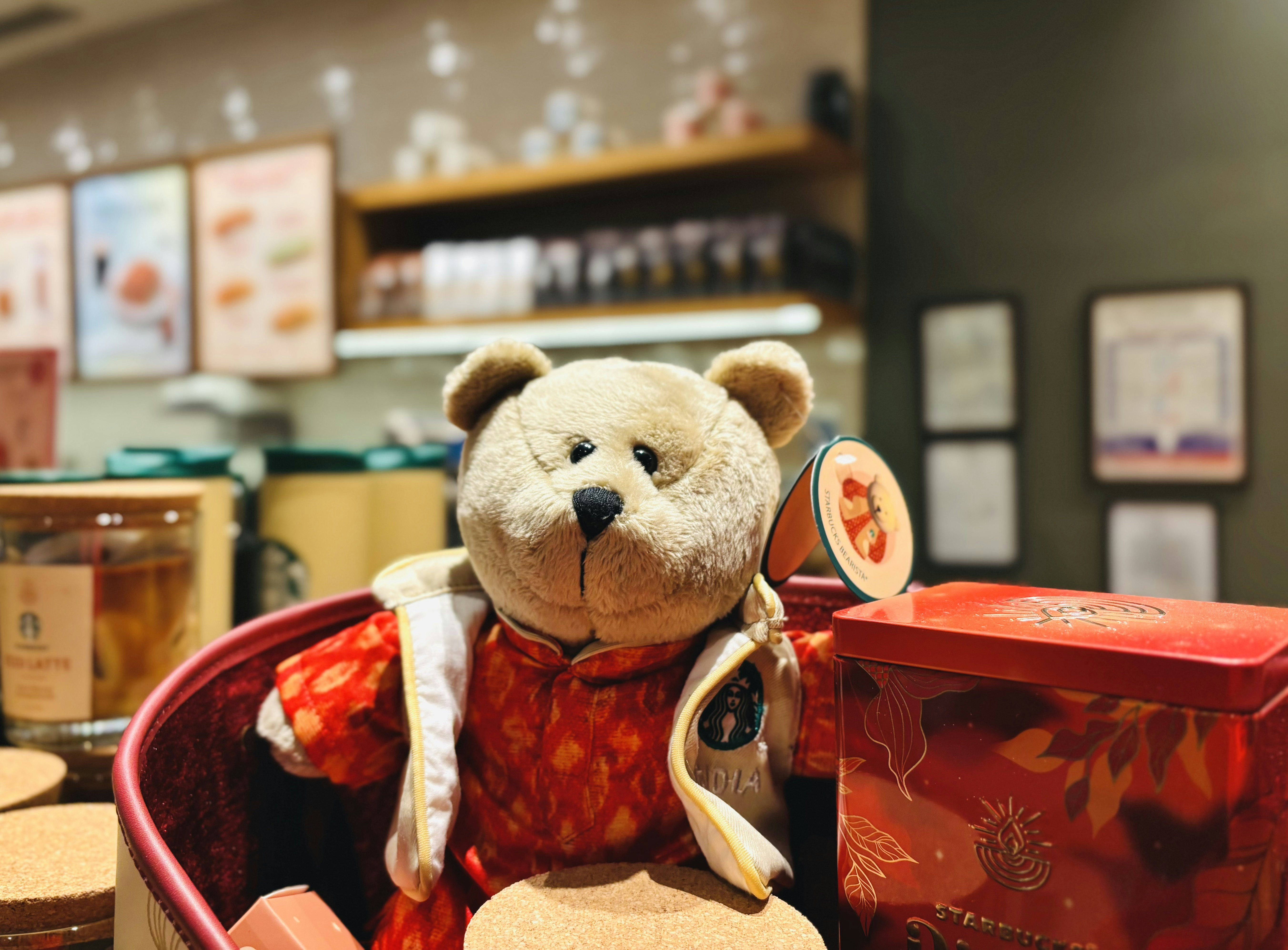 A teddy bear sitting in a basket in a store