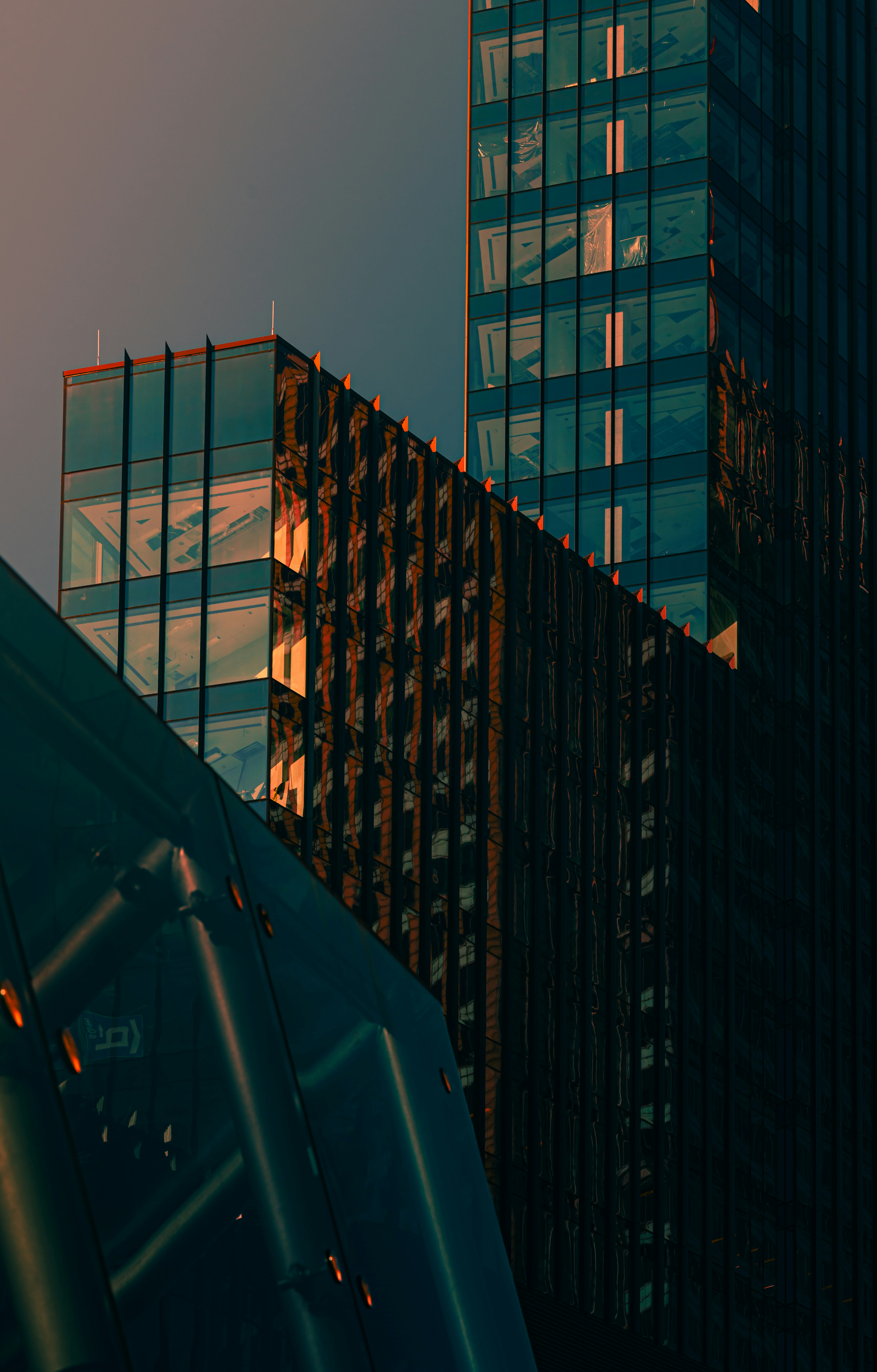 A very tall building next to other tall buildings