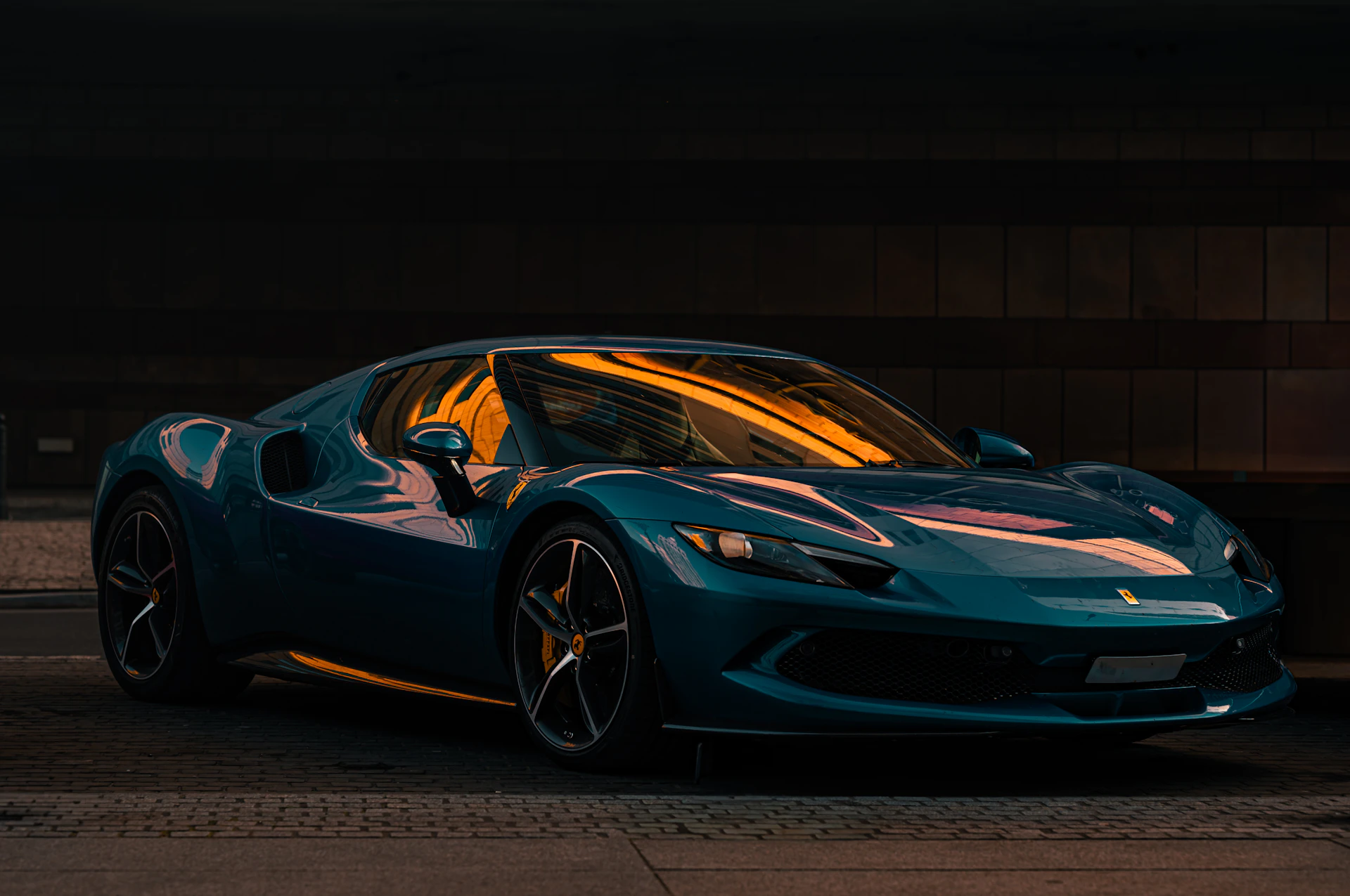 A blue sports car parked in a parking garage