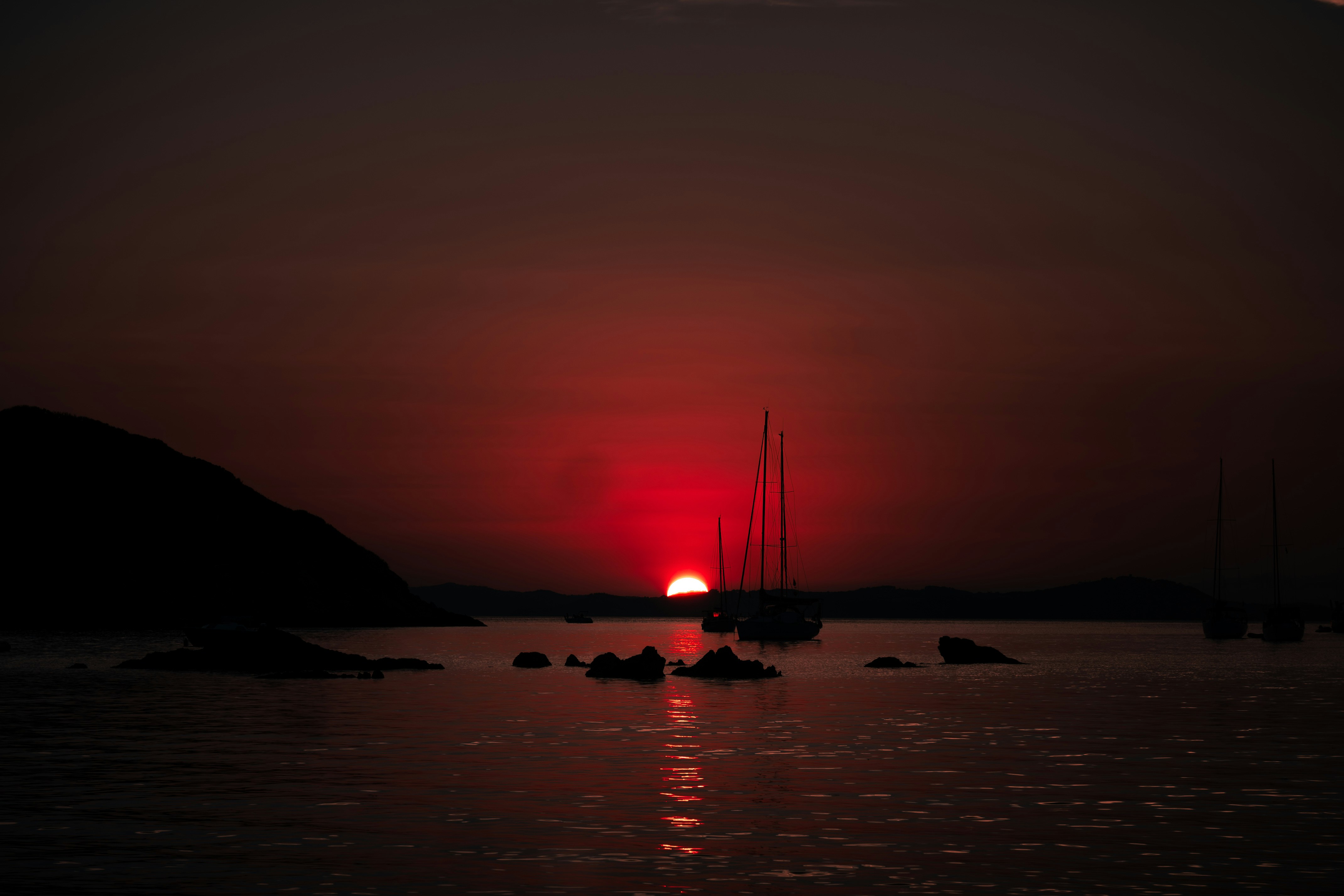 The sun is setting over a body of water