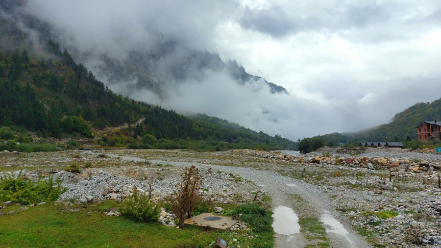 A gravel road winding through a high alpine valley