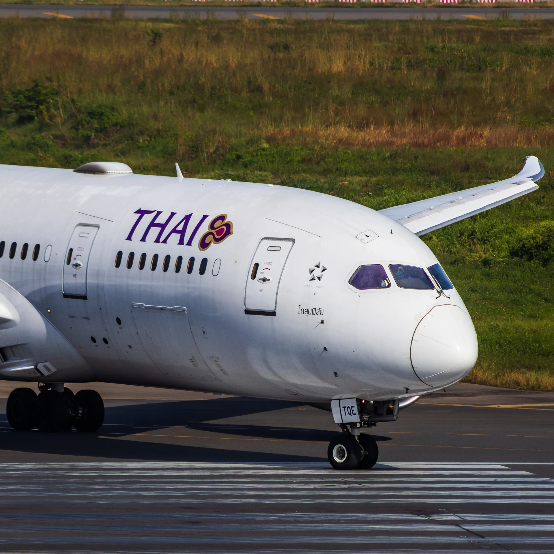 A large white airplane on a run way