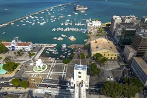 An aerial view of a city with boats in the water