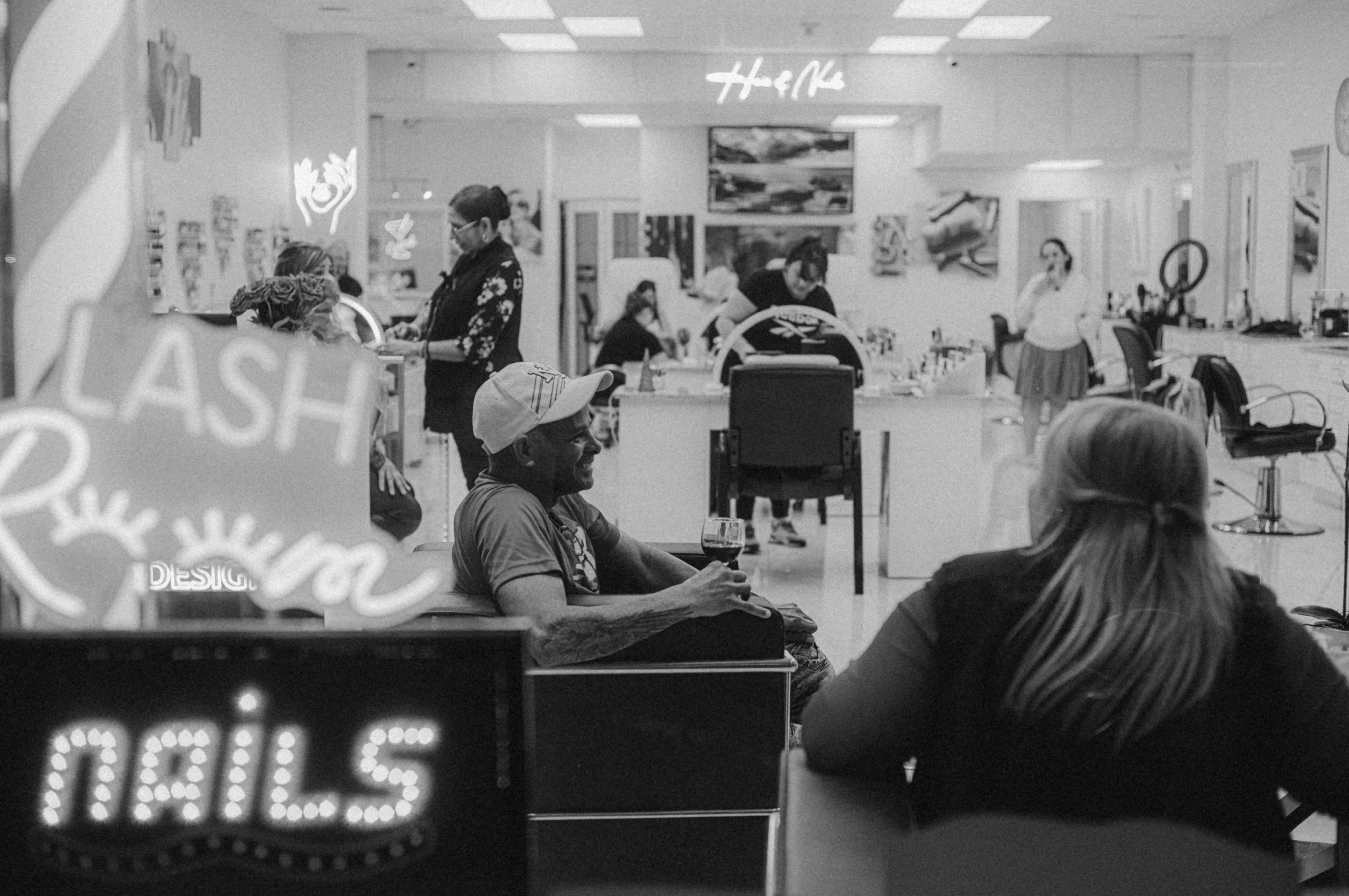 A black and white photo of a hair salon