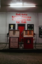 A red fire hydrant sitting in front of a building