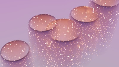 A row of bubbles sitting on top of a purple surface