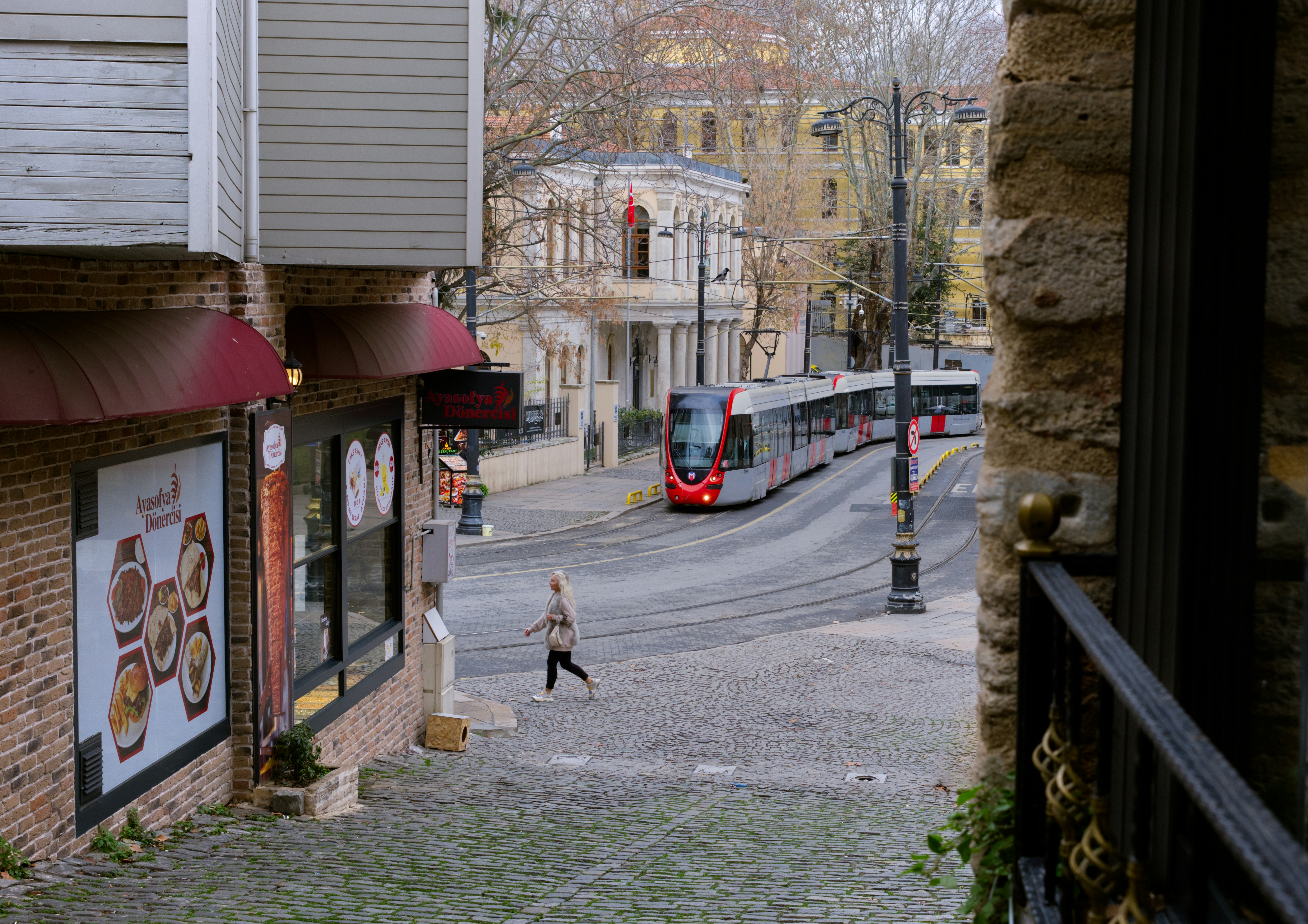 A person walking down a street in a small town