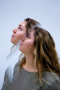 A woman looking up at something in the air