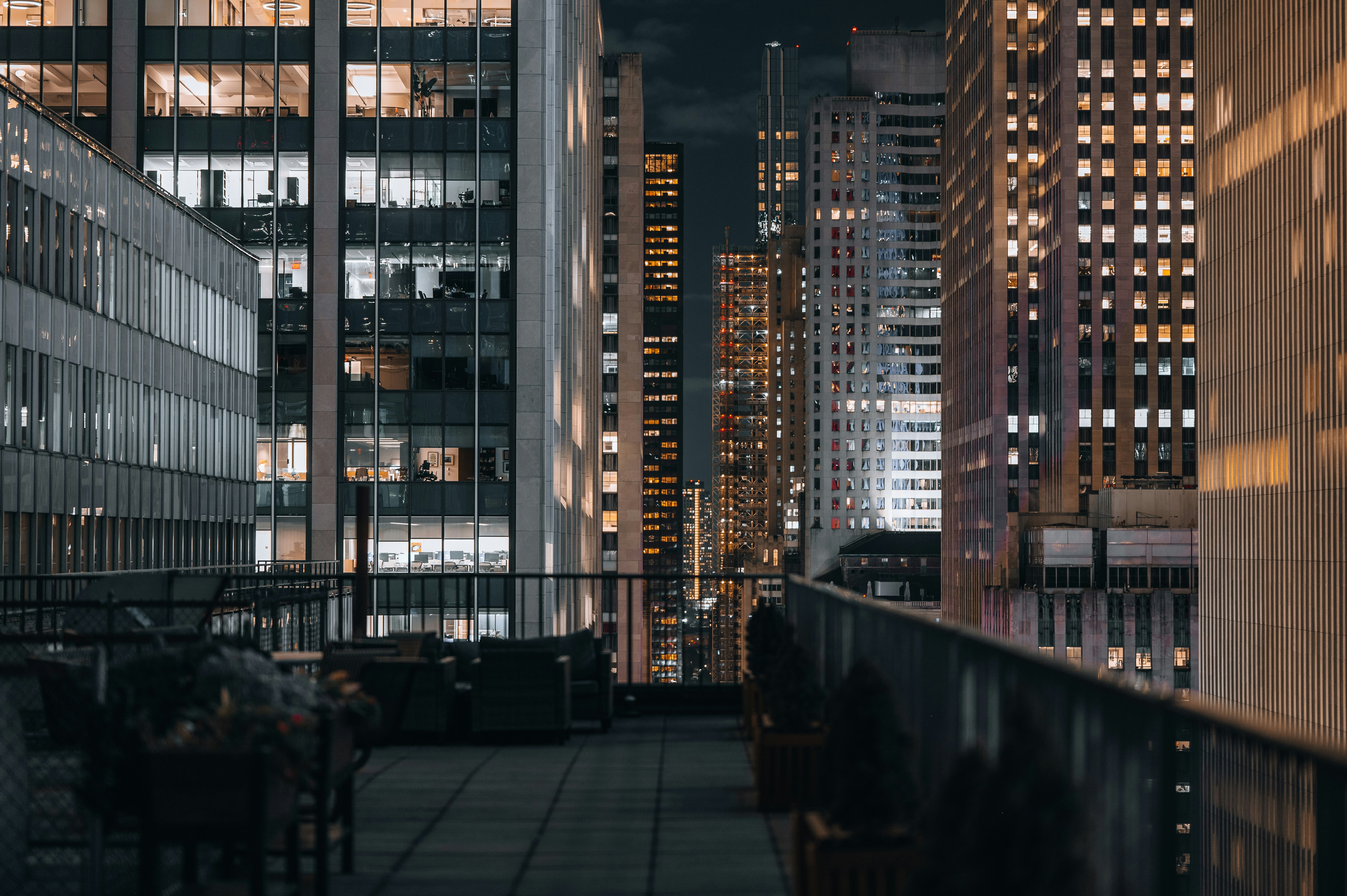 A view of a city at night from a rooftop