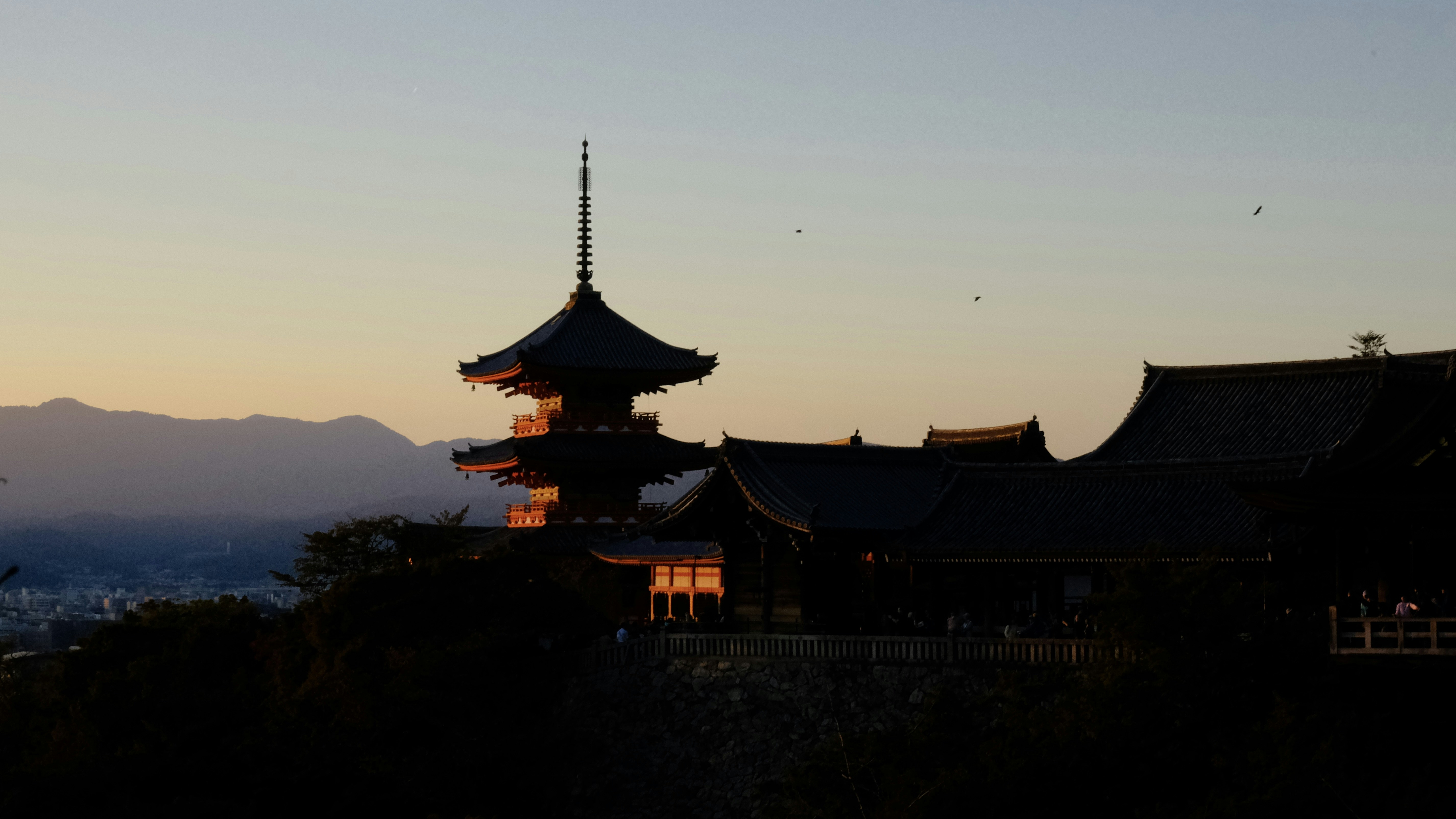 A tall building sitting on top of a hill