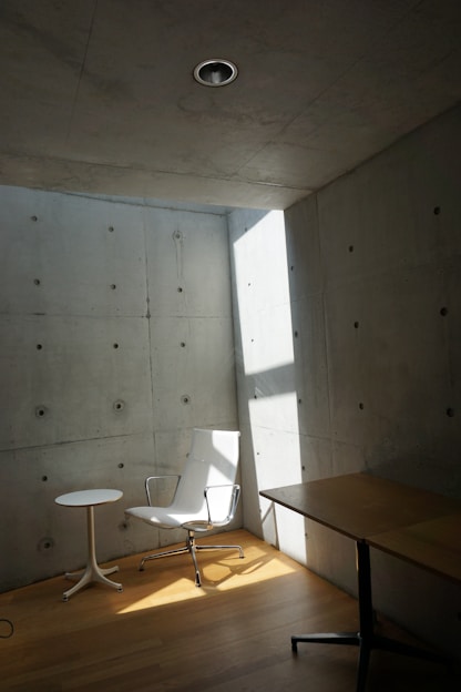 A room with a chair and a table in it