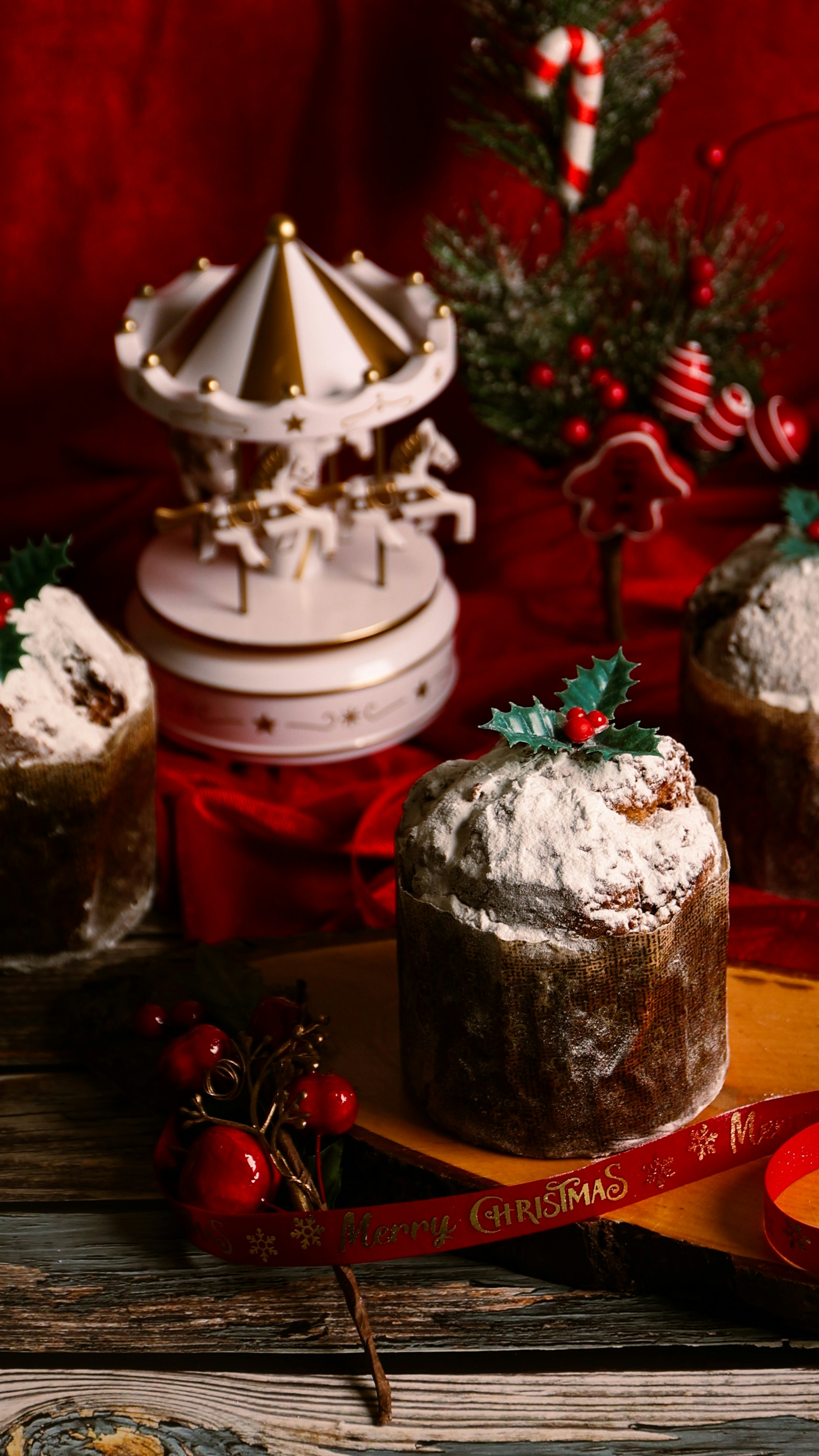 A table topped with cakes covered in frosting