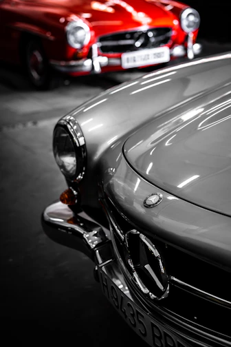 A close up of two cars parked next to each other