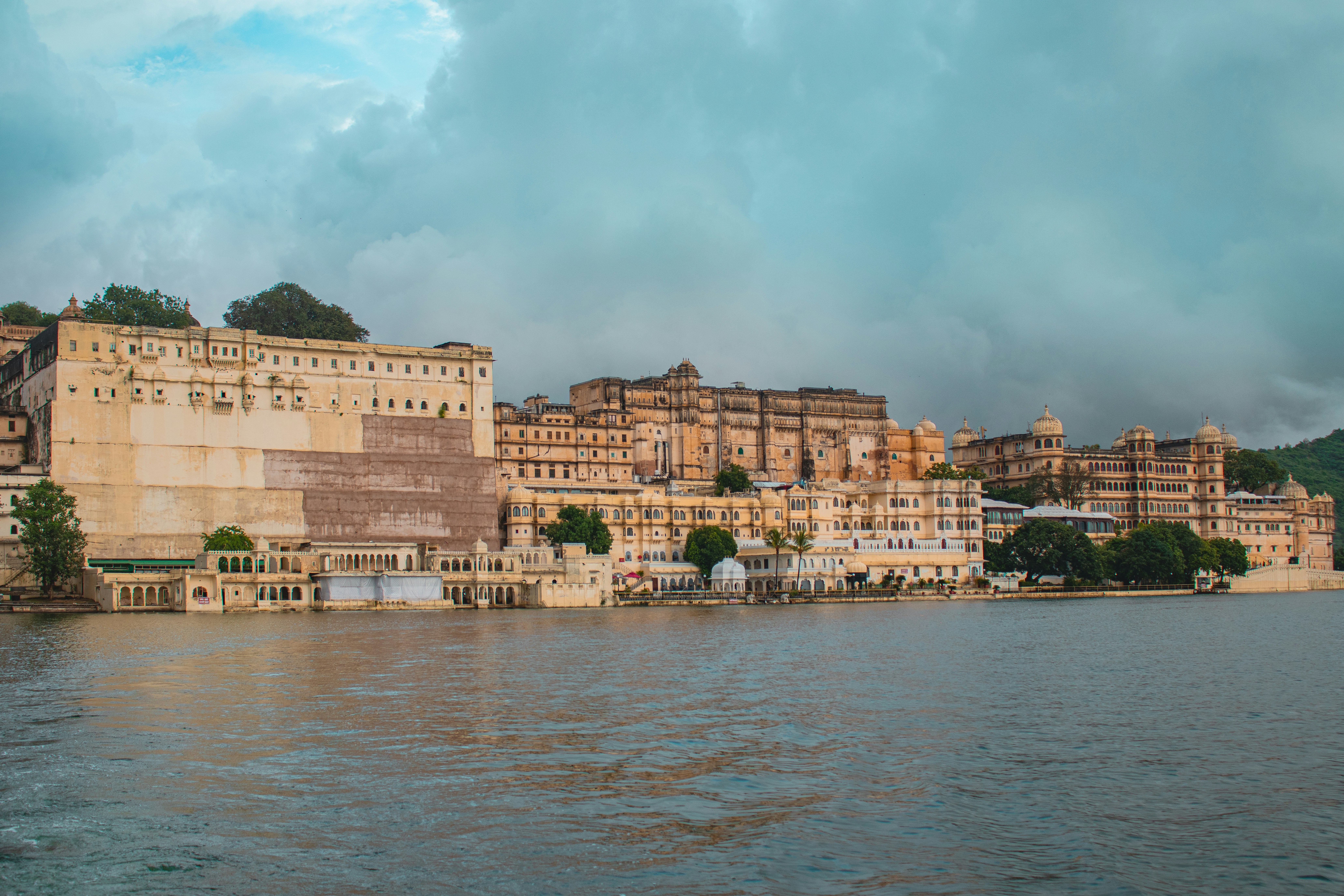 A large body of water with buildings in the background