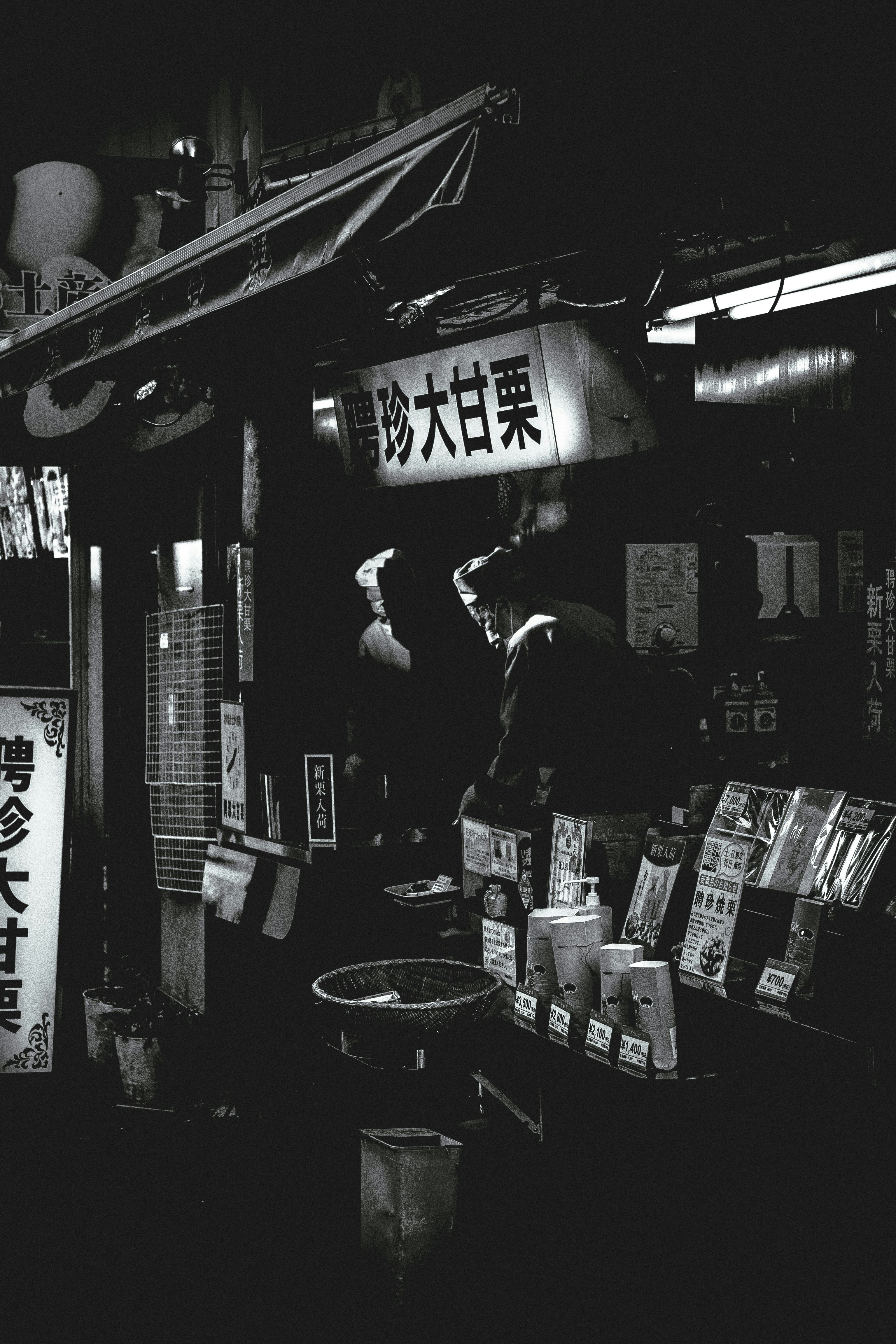 A black and white photo of a store front