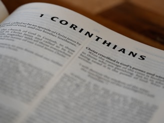 A close up of an open book with the word corinhans on it