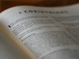 An open book sitting on top of a wooden table