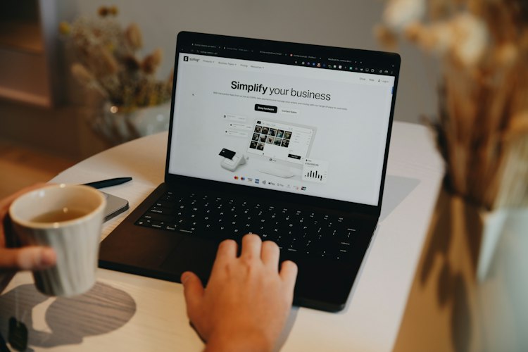 Laptop displaying a chat widget open on a small business website