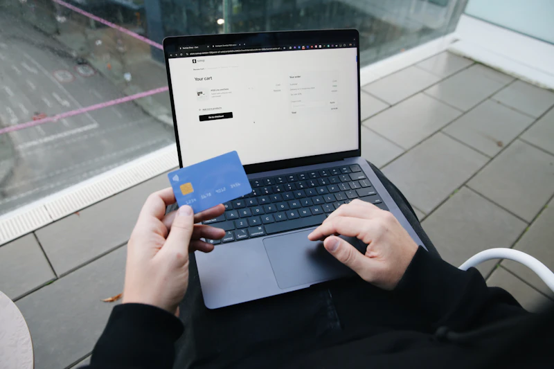 Person shopping online with a payment card