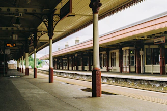 A train station with a train on the tracks