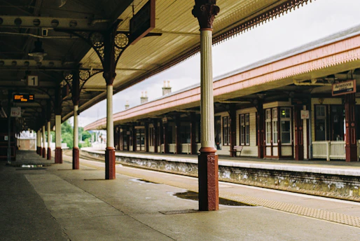 A train station with a train on the tracks