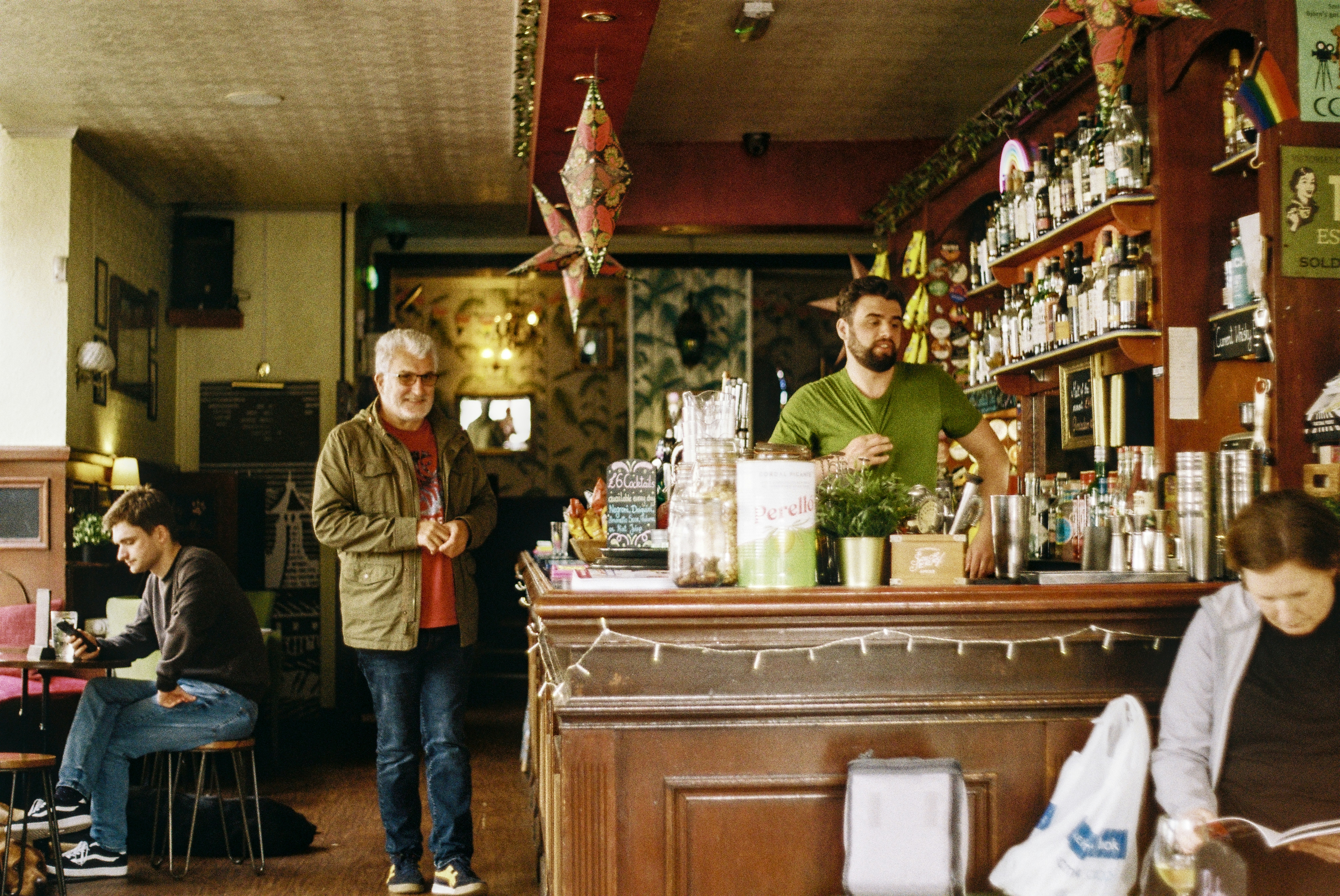 A group of people sitting at a bar in a restaurant