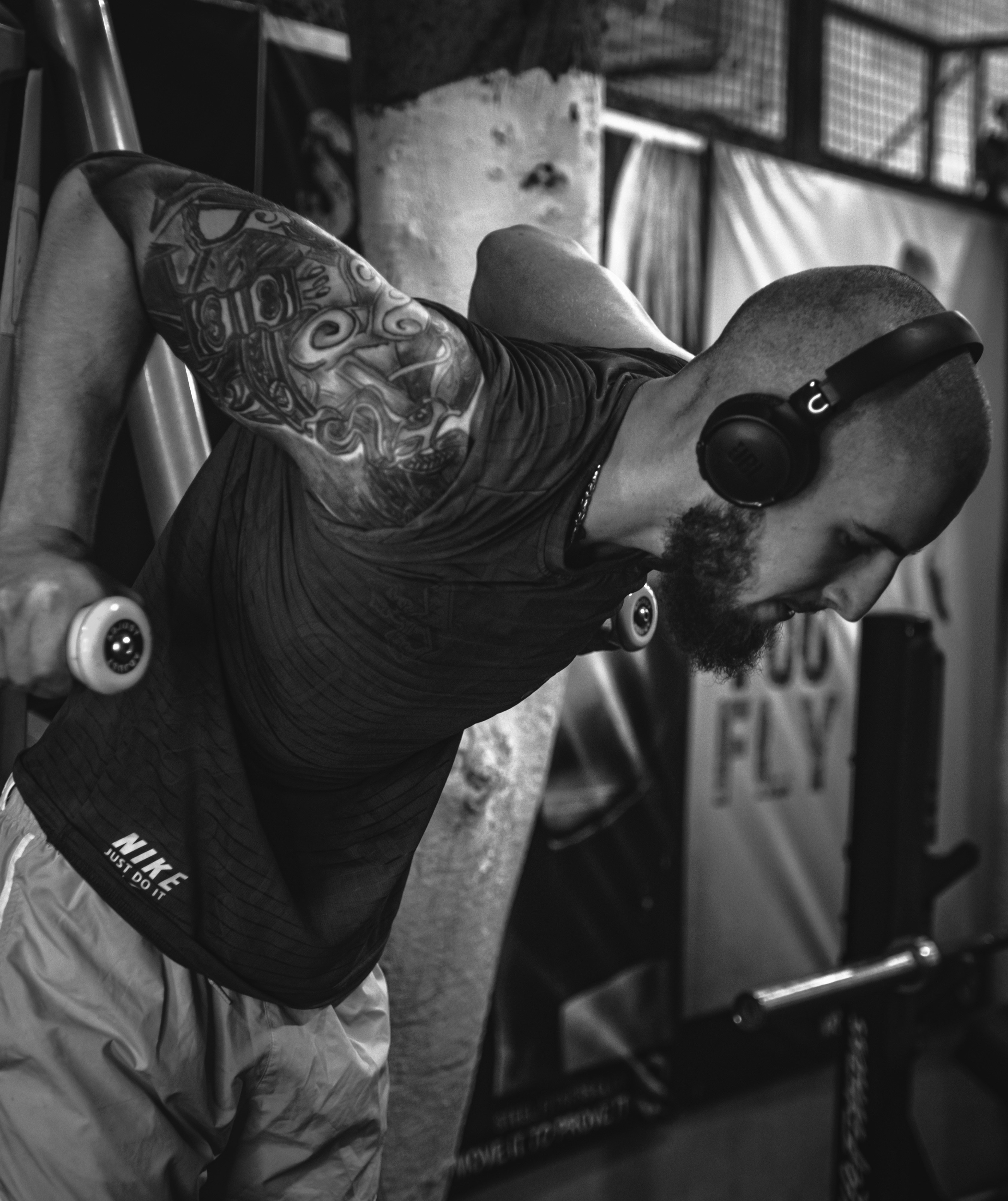 A man doing a handstand in a gym