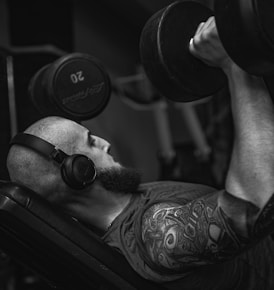 A man doing a bench press with a barbell