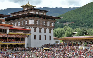 A large crowd of people in front of a building