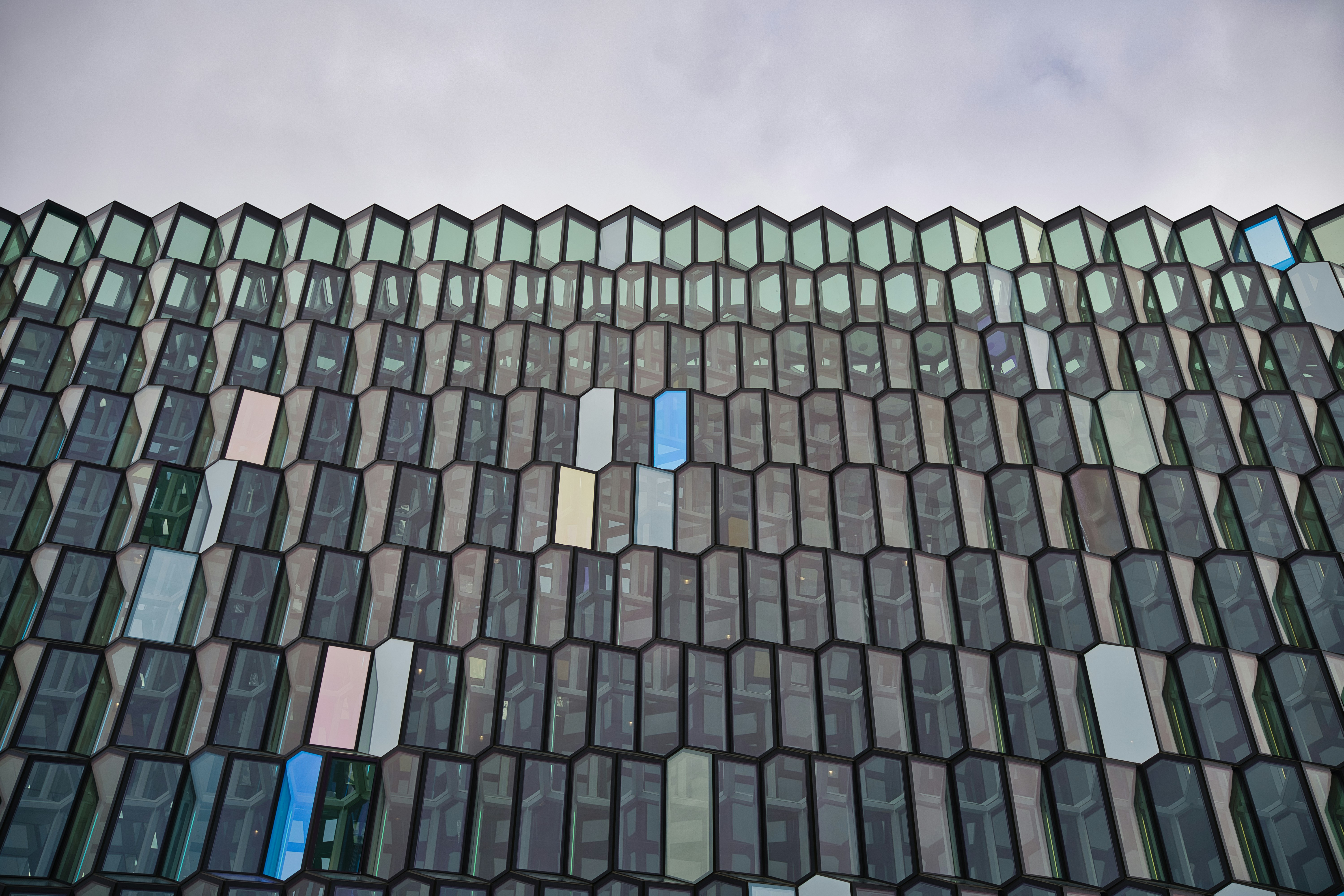 A close up of a tiled roof with sky in the background
