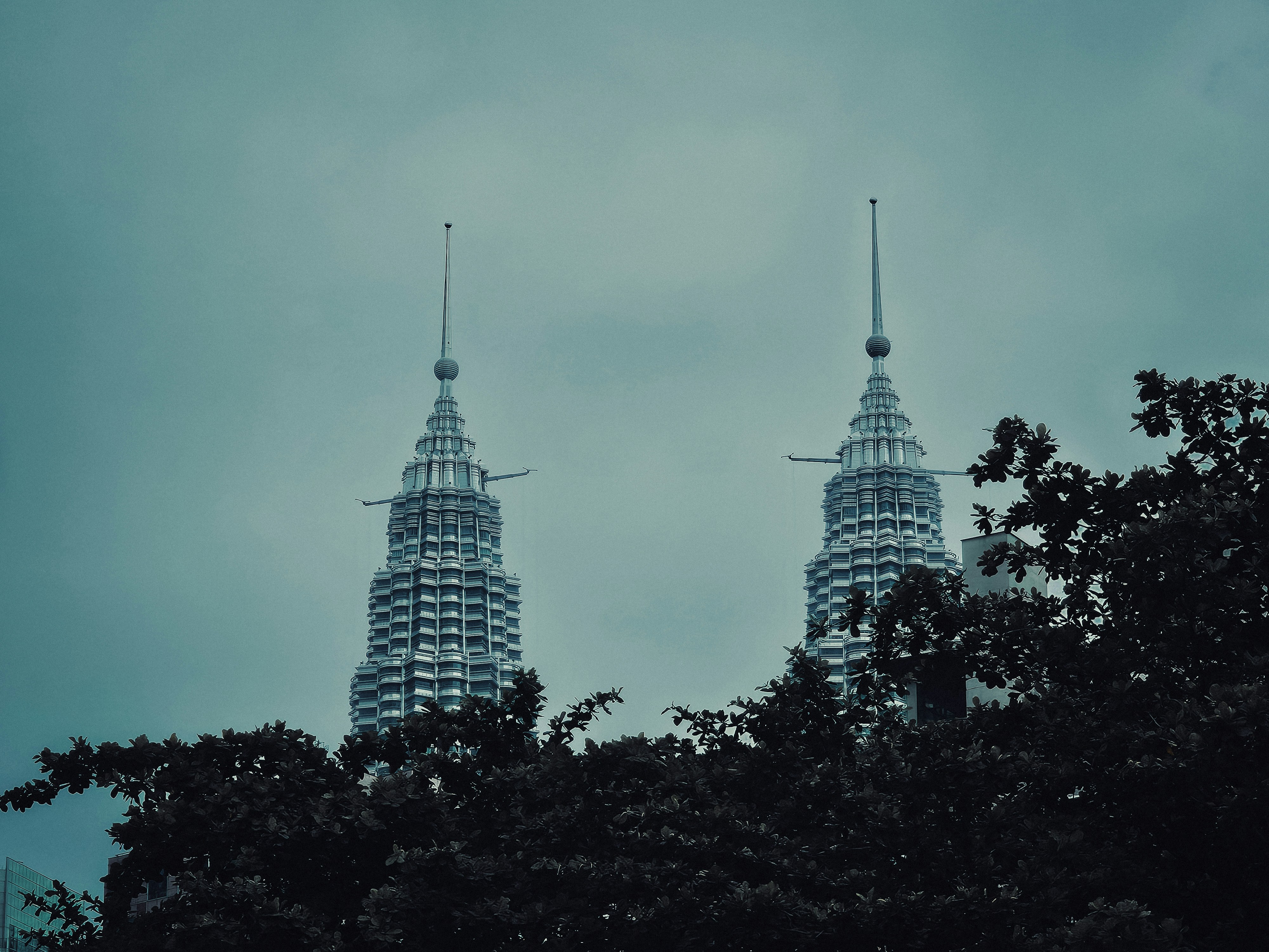 A couple of tall buildings sitting next to each other