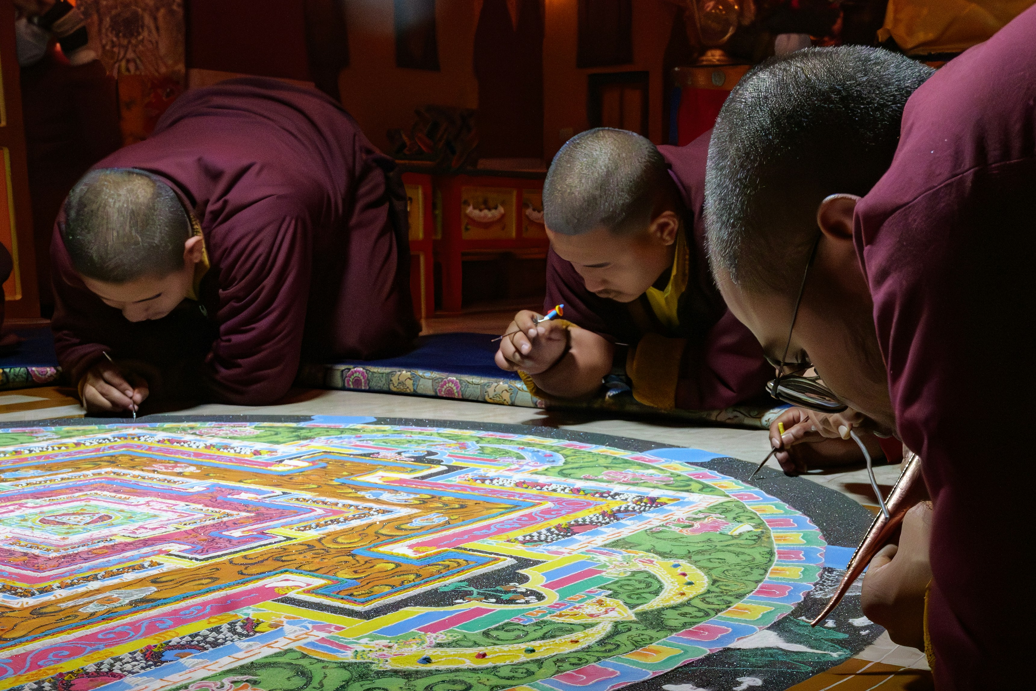 Image credit: Ellen Reitman via unsplash
Image of sand mandala art by tibetan monks, popular tourist attration near tibet