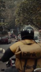 A person riding a motorcycle on a city street